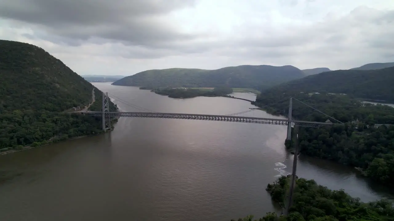 aerial push into bear mountain bridge over the hudson river near highland falls new york