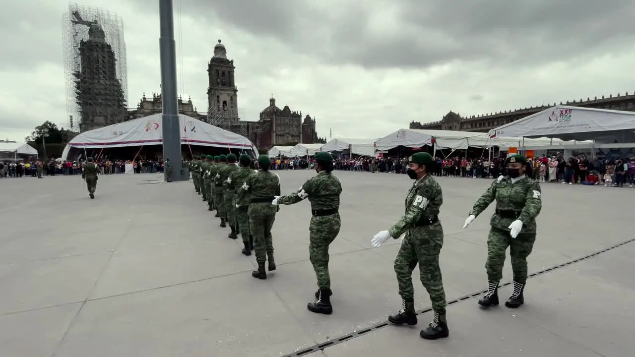 shot of members of the mexican army performing honors to the flag in the zocalo of mexico city