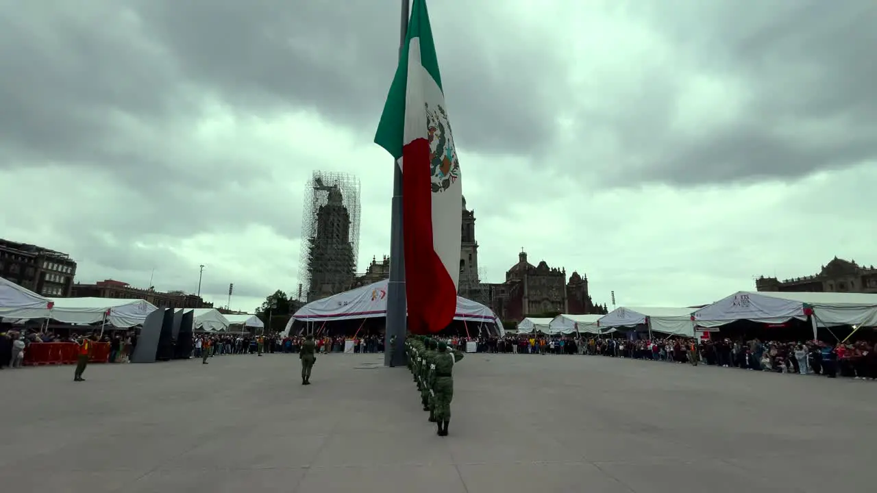 slow motion shot of mexican soldiers accommodating the flag