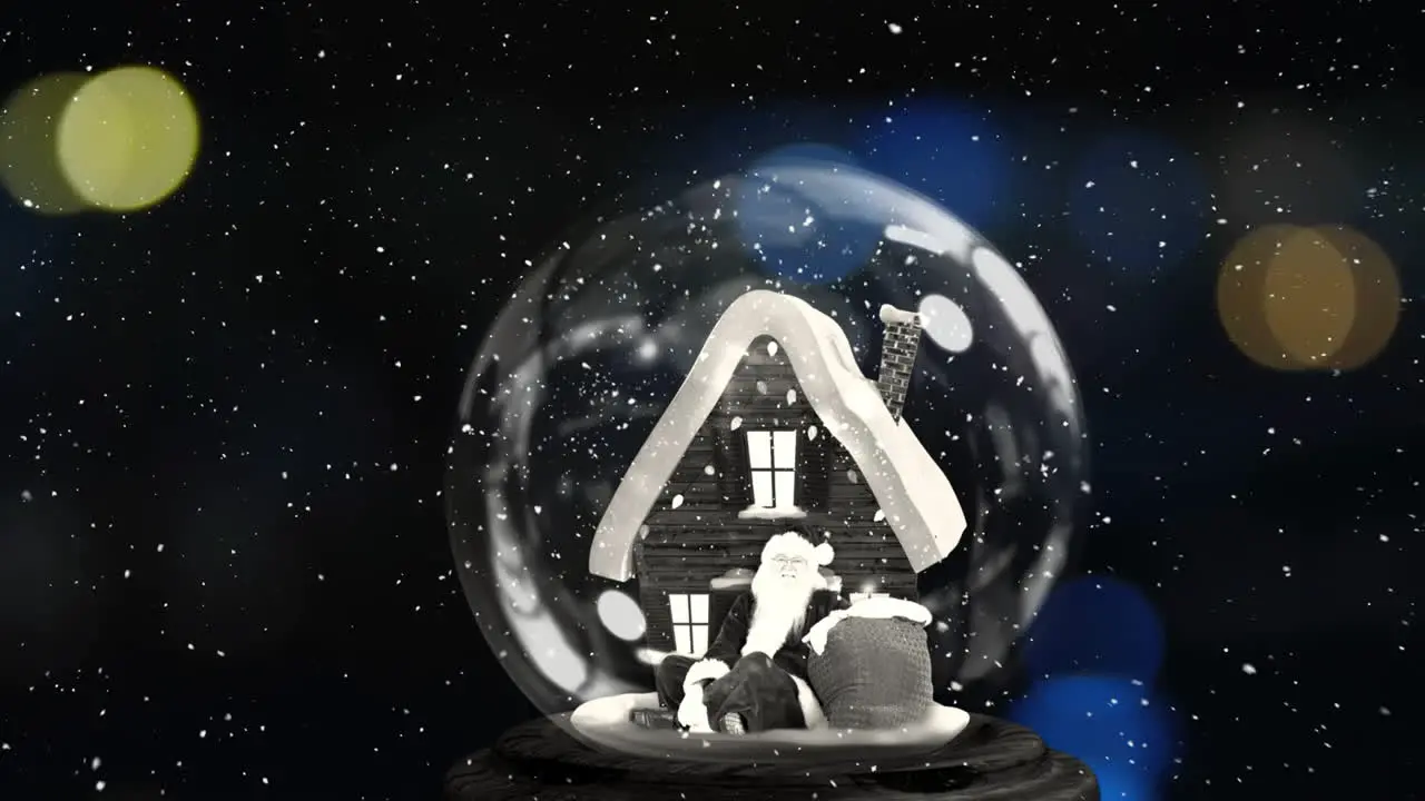 Animation of snow falling over christmas snow globe with house and santa claus