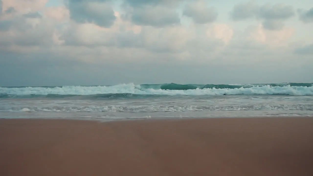 Beautiful view of storm in cloudy day Waves rolling onto sunset beach