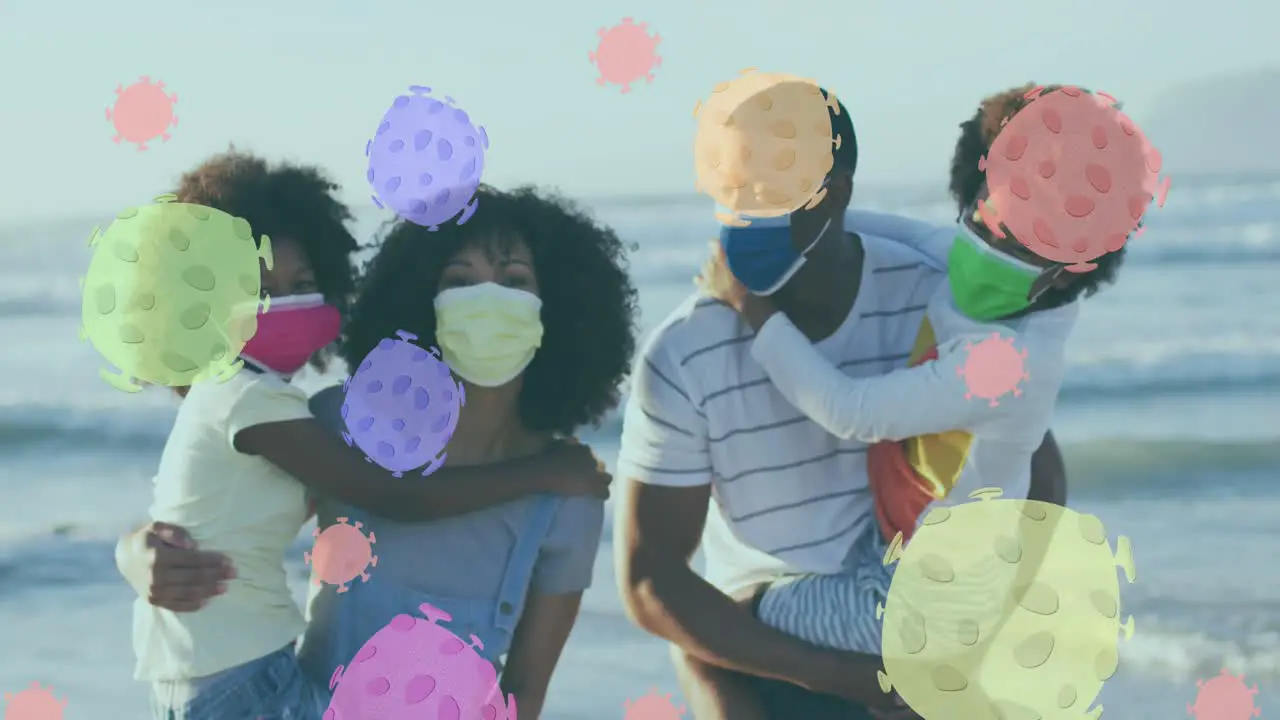 Animation of virus cells over african american family with face masks on sunny beach