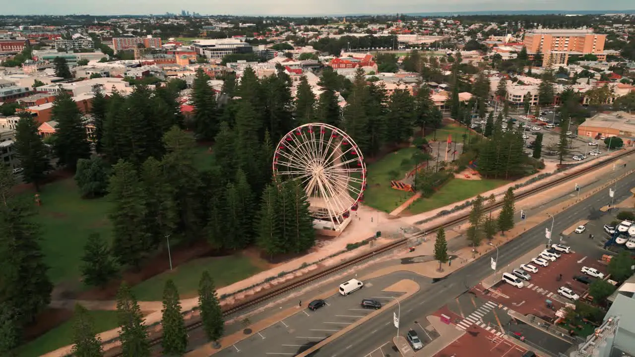 drone shot around Fremantle ferris wheel in Perth suburbs in Western Australia with the harbour in the background