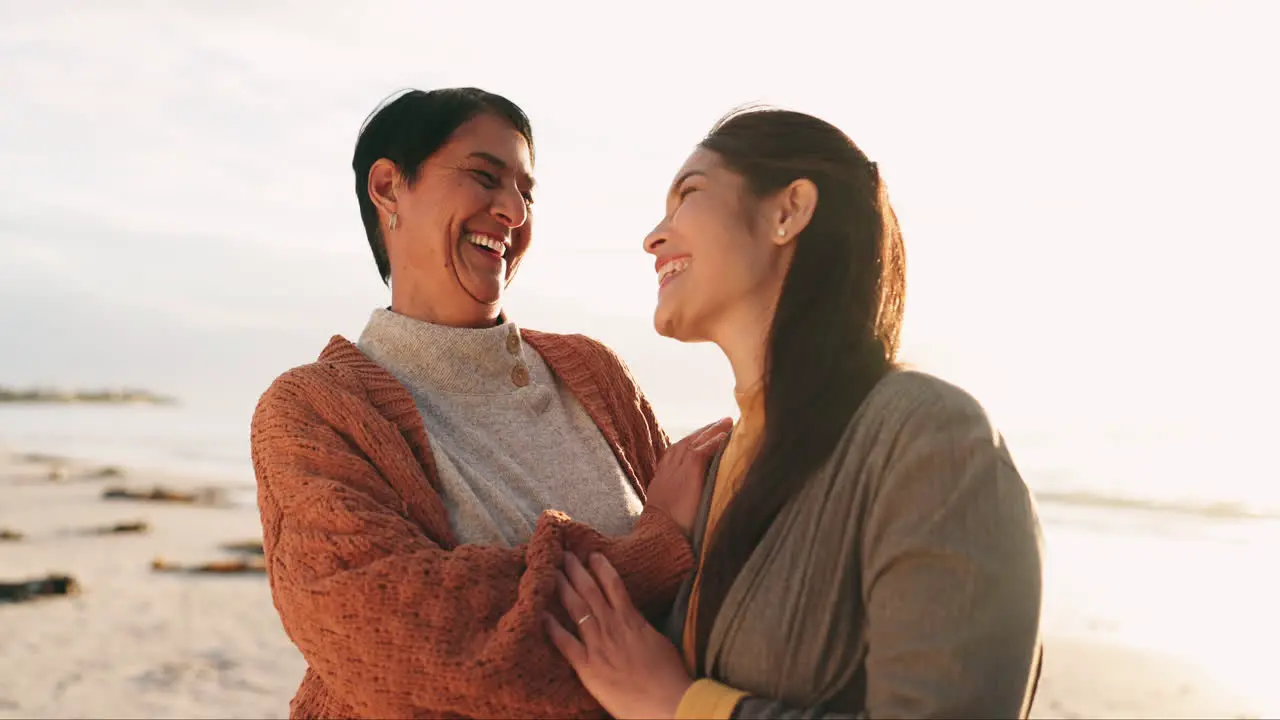 Senior mother and woman with love on the beach