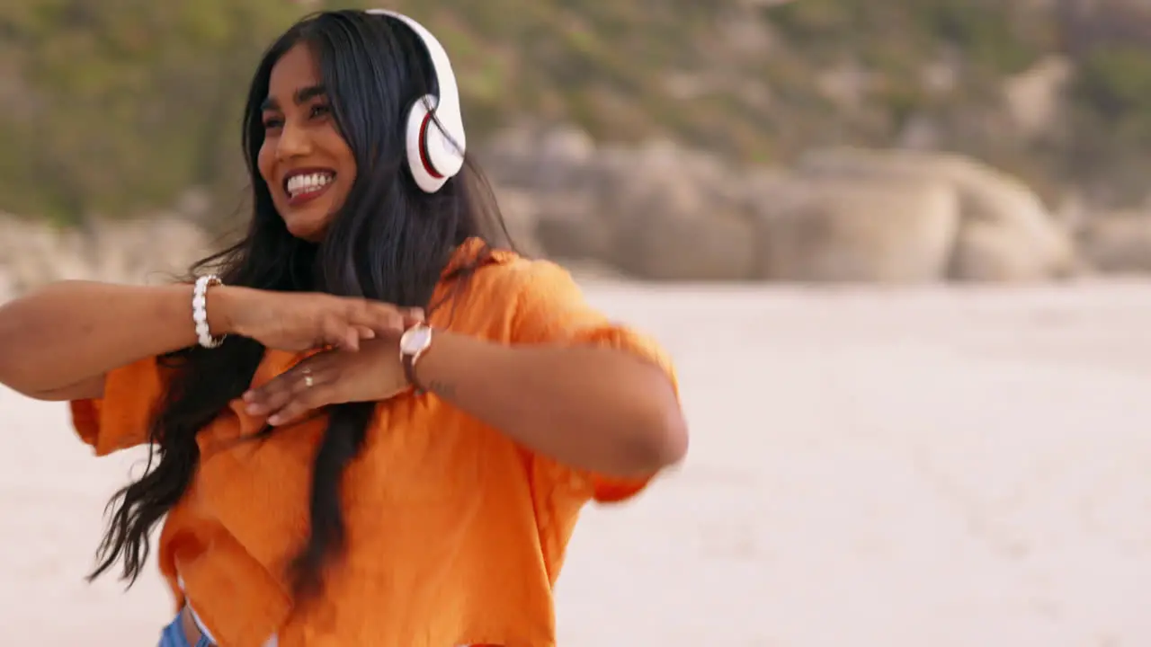 Headphones dance and woman on the beach