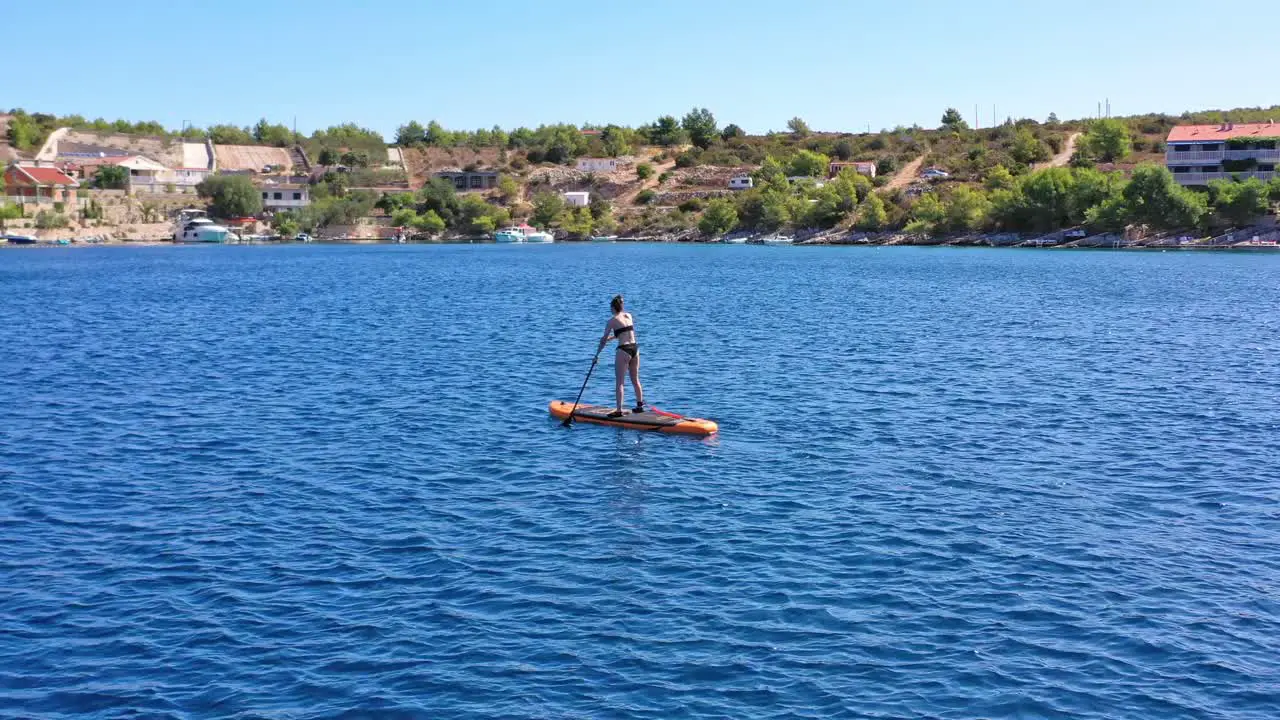 woman on stand up paddle