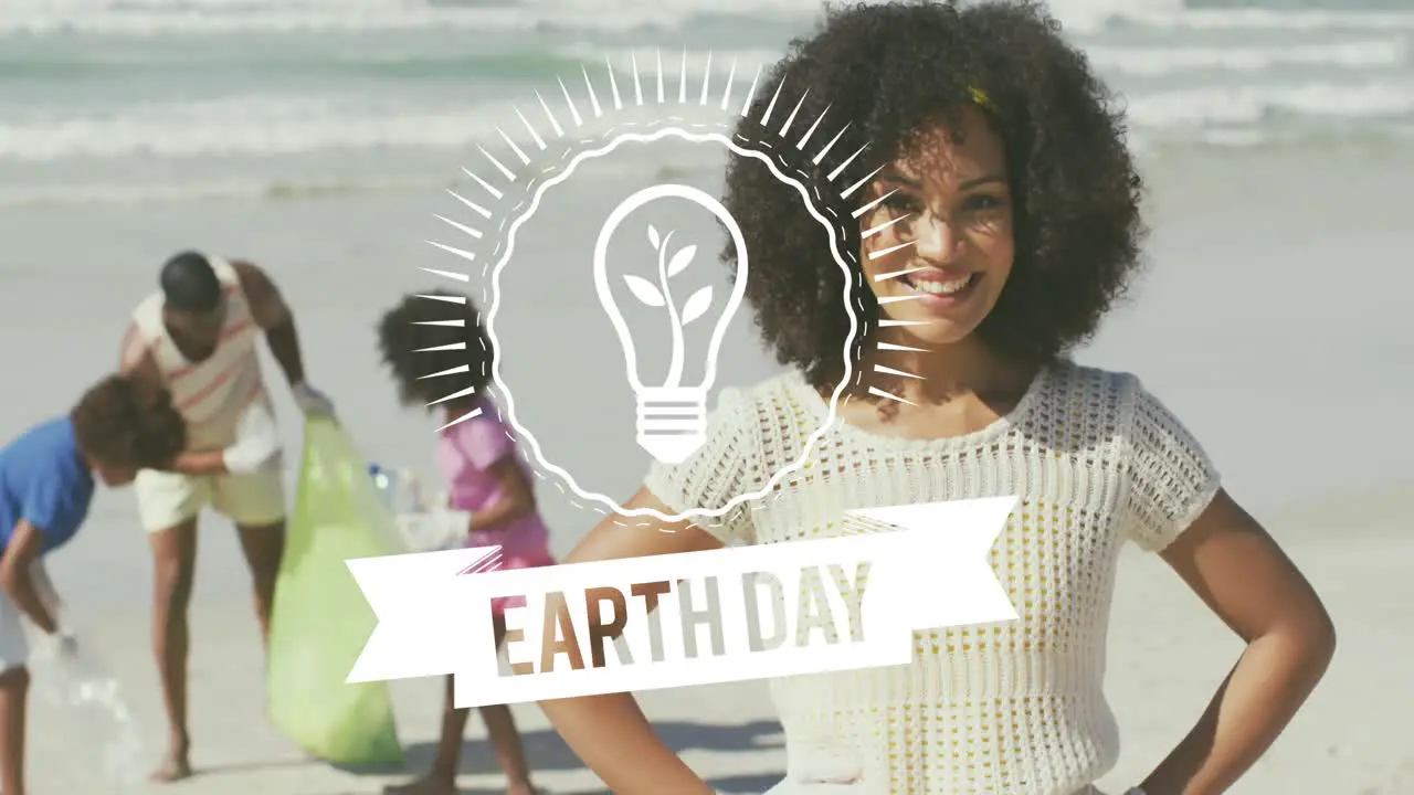 Animation of earth day text over happy african american family picking waste on sunny beach