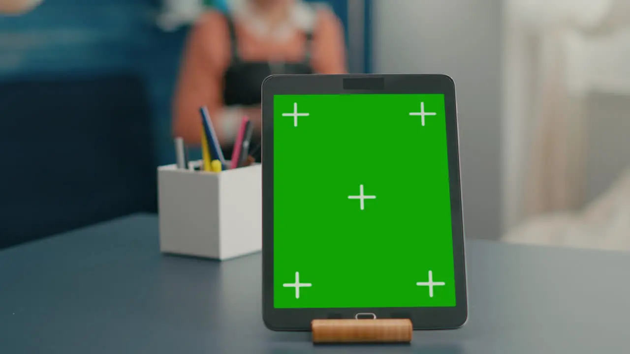 Close up of tablet computer with mock up green screen chroma key display