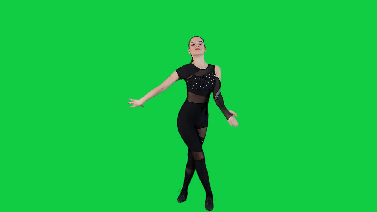 Attractive Woman Dancer in Black Bodysuit dancing in front of a Green screen