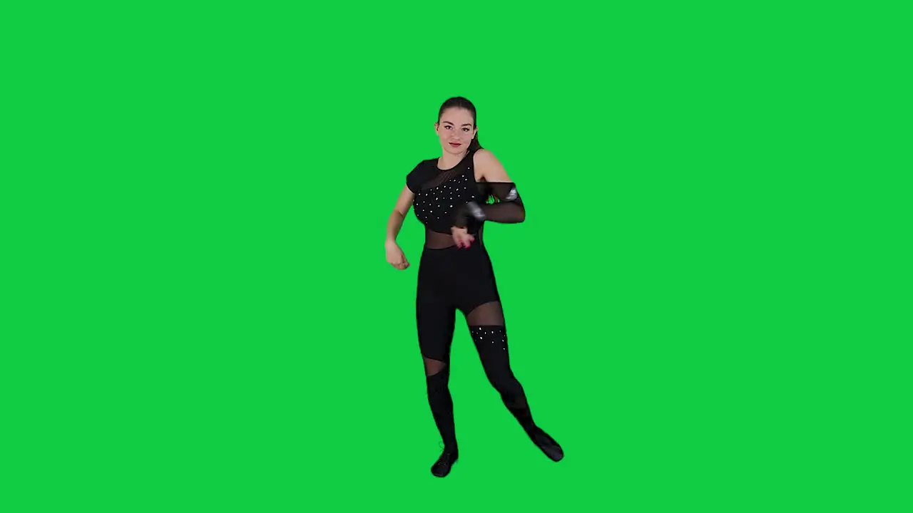 Young beautiful girl dancing modern dancehall in front of green screen background