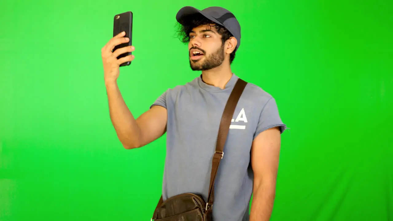 indian tourist taking selife on road with green background green screen