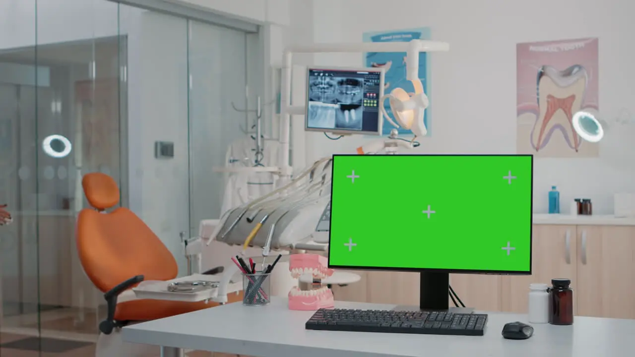 Dental cabinet with horizontal green screen on monitor