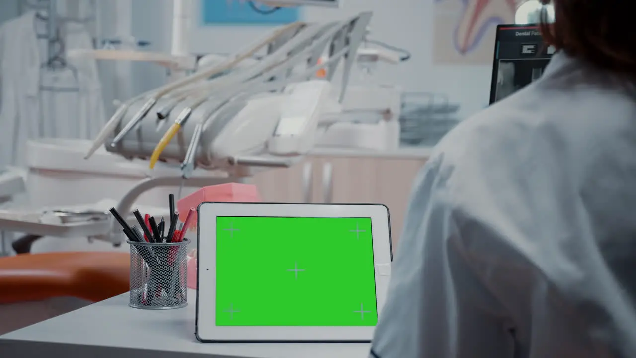 Close up of digital tablet with horizontal green screen