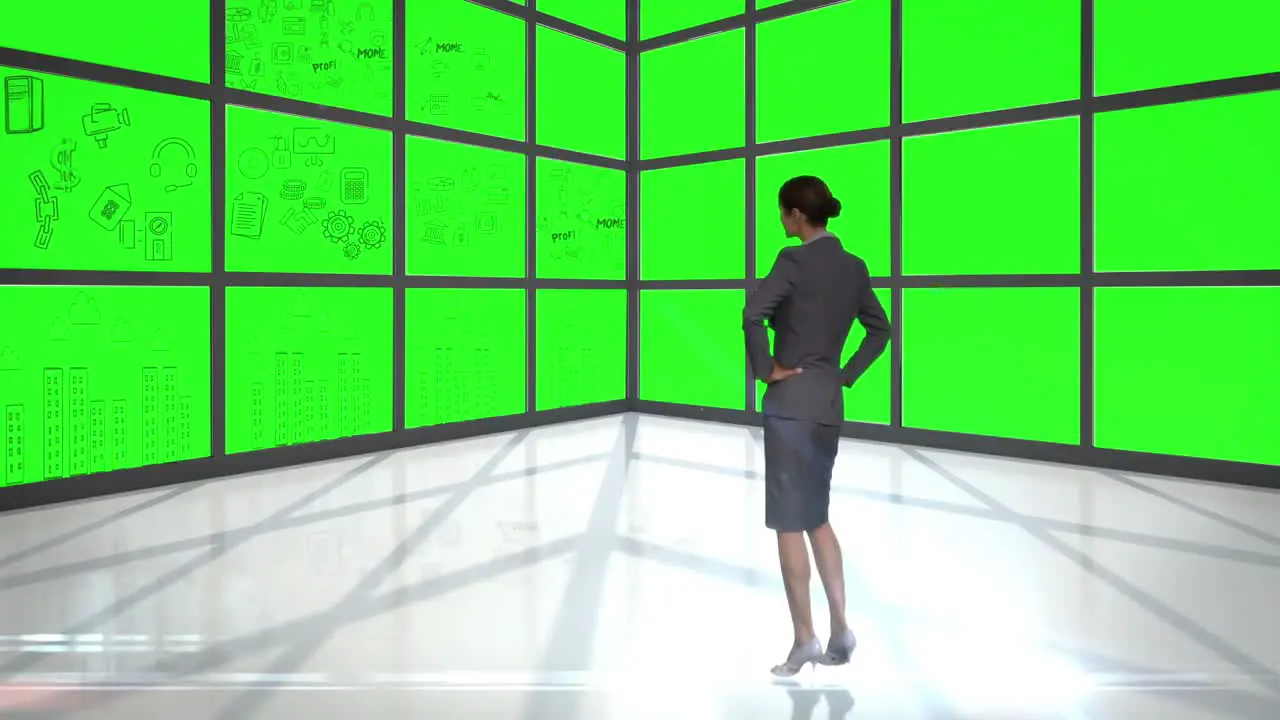 Businesswoman looking at green interface