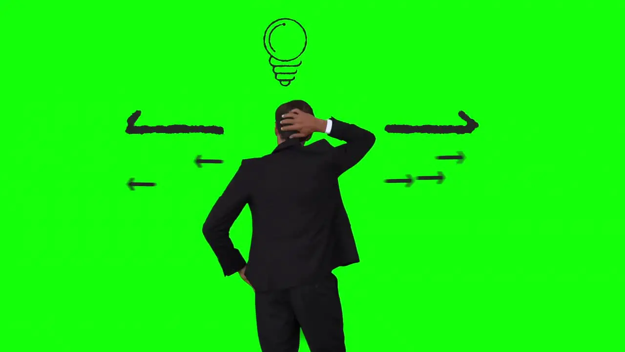 Businessman having an idea in front of green interface