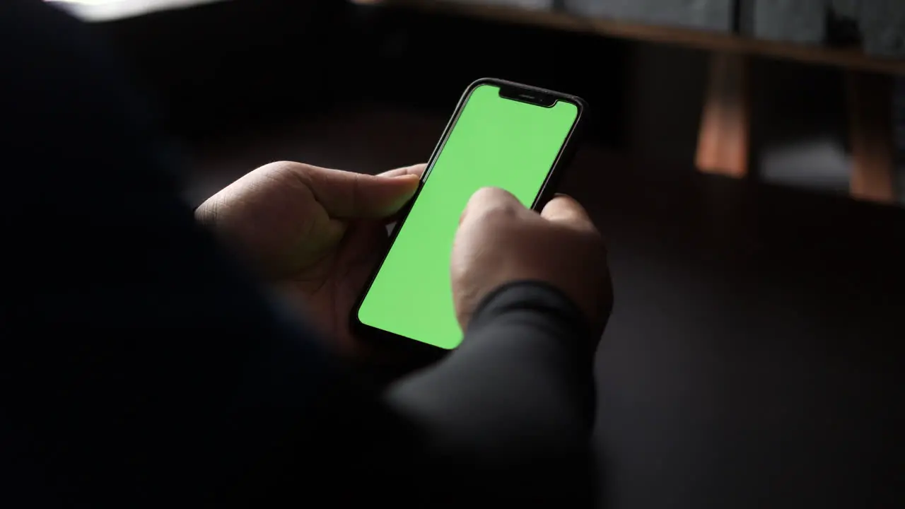 Close up and slide movement of a man using a smartphone