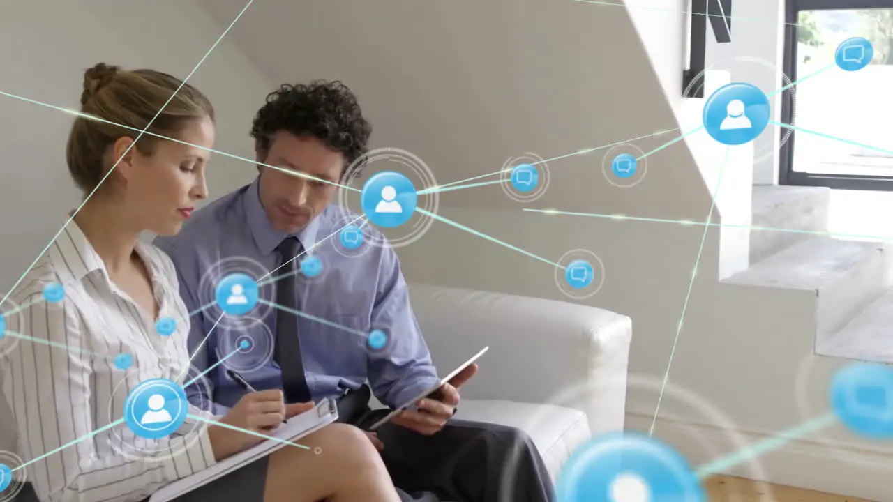 Animation of network of connections with icons over diverse businesspeople using tablet