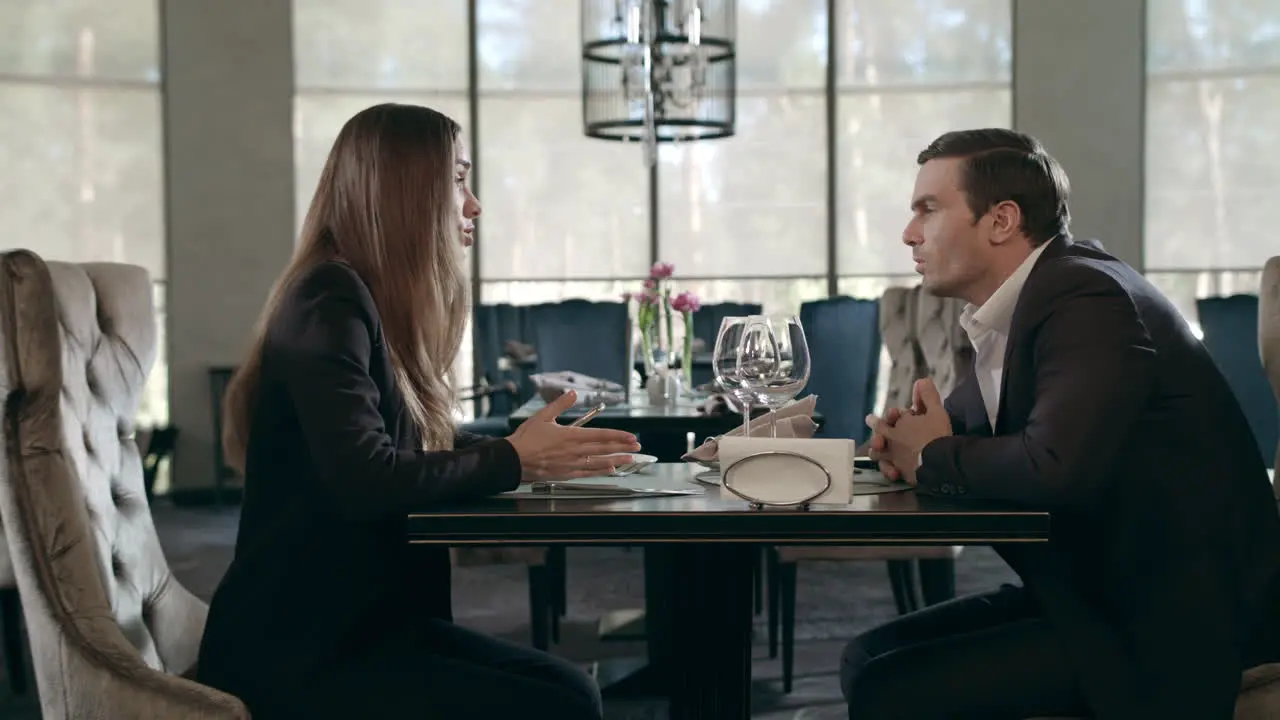 Business couple talking at restaurant Business man and woman meeting in cafe