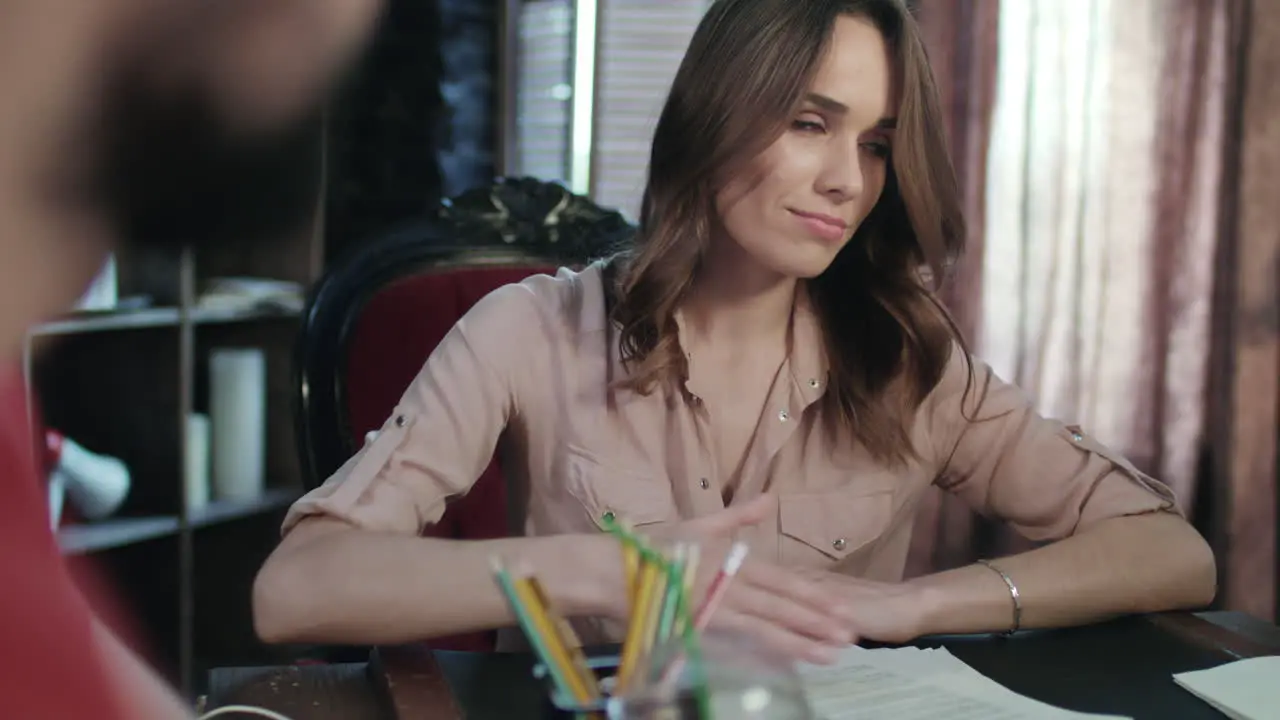 Business woman talking with business partner during negotiations in office