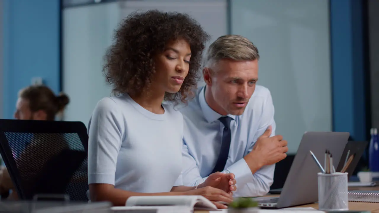 Businesswoman and businessman having video conference with business partners