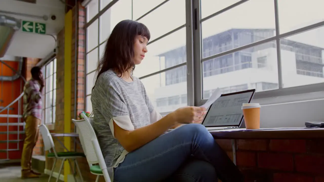 Businesswoman working at desk in a modern office 4k