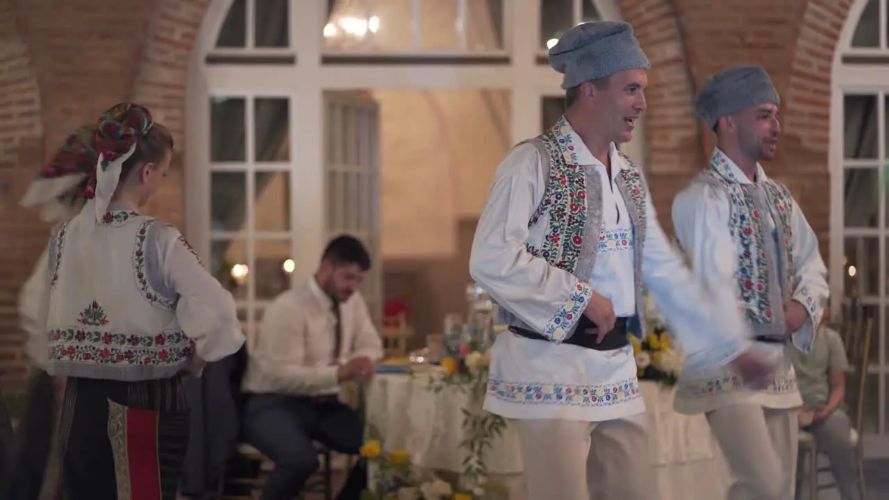 Romanian traditional dancers performing at wedding party