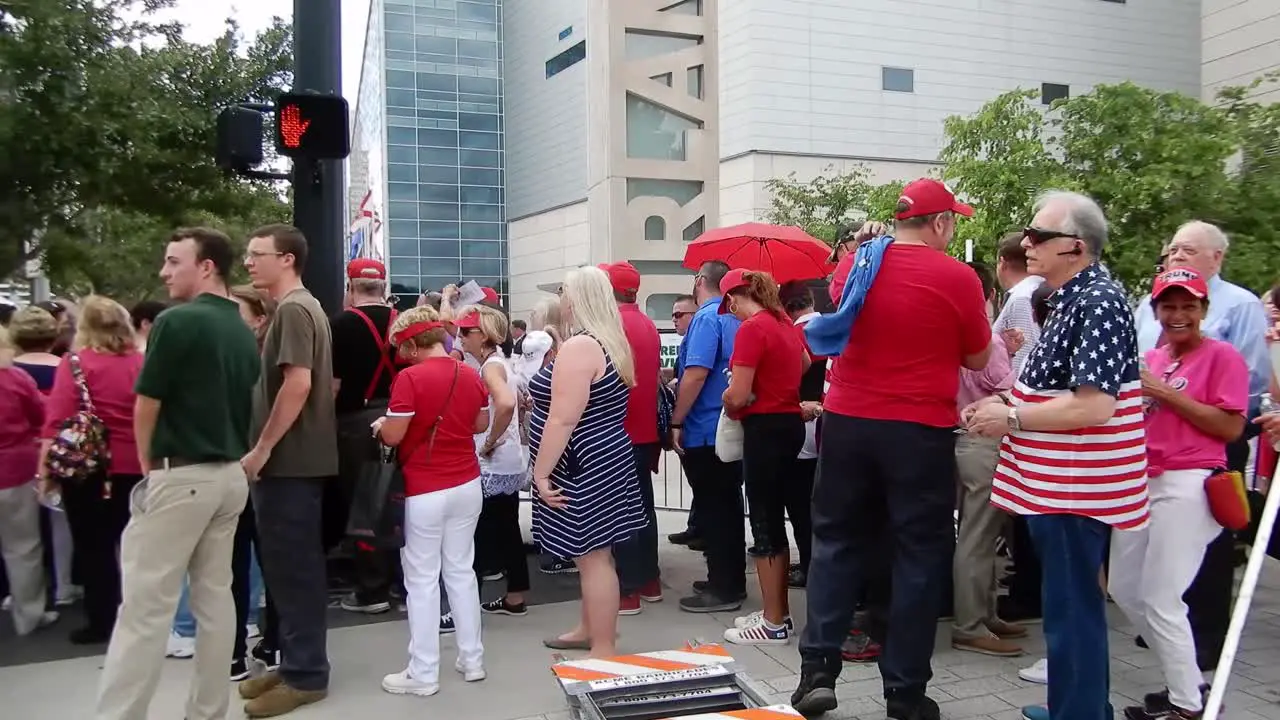 People gather to hear and see President Donald Trump at a political rally