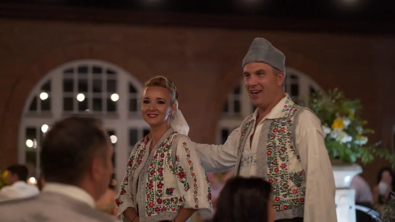 Romanian traditional singers perform at a wedding party