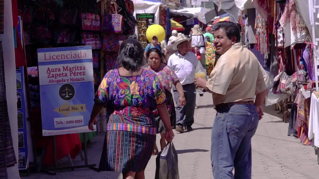 Indigenous people walking through the Chichi market in Guatemala