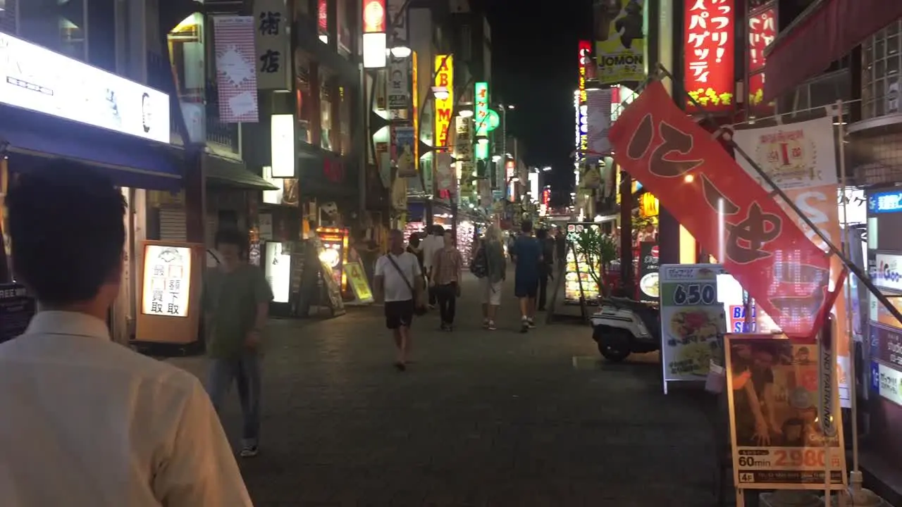 Shops and People in Downtown Tokyo at night