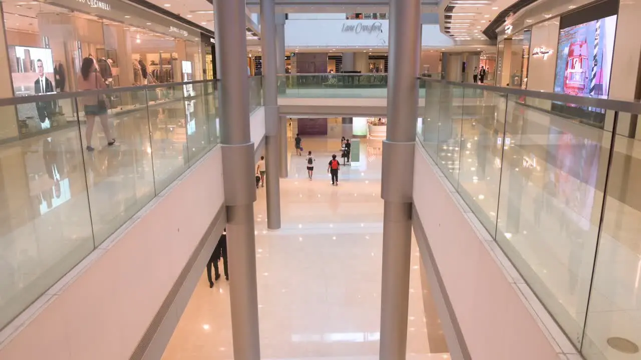 Shoppers are seen at a high-end luxurious IFC shopping mall in Hong Kong