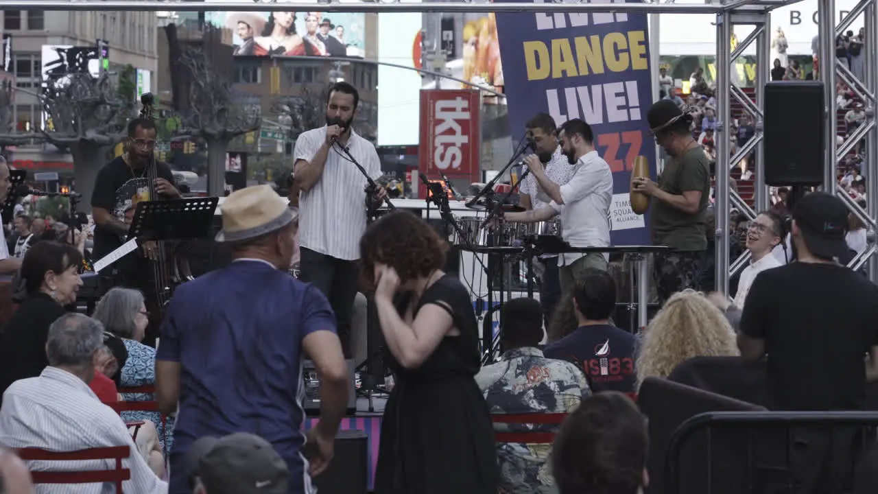 People in New York city dancing to salsa music