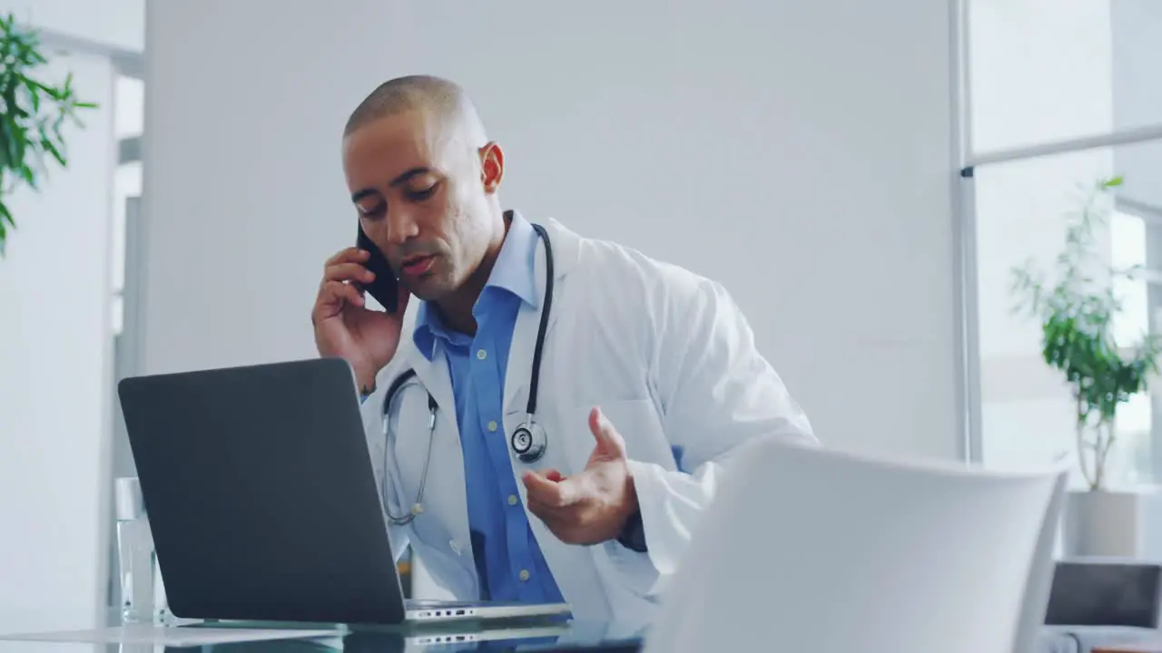 Male doctor talking on mobile phone 4k