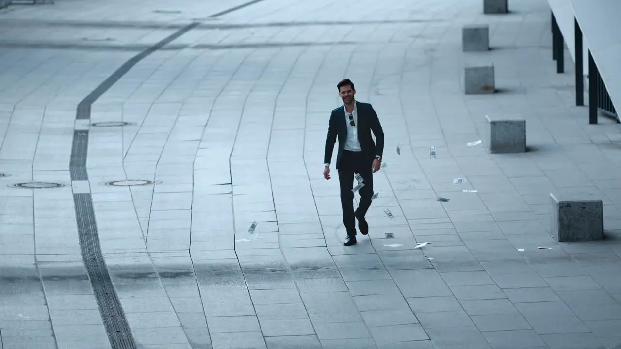 Confident businessman throwing money at street Businessman walking at city