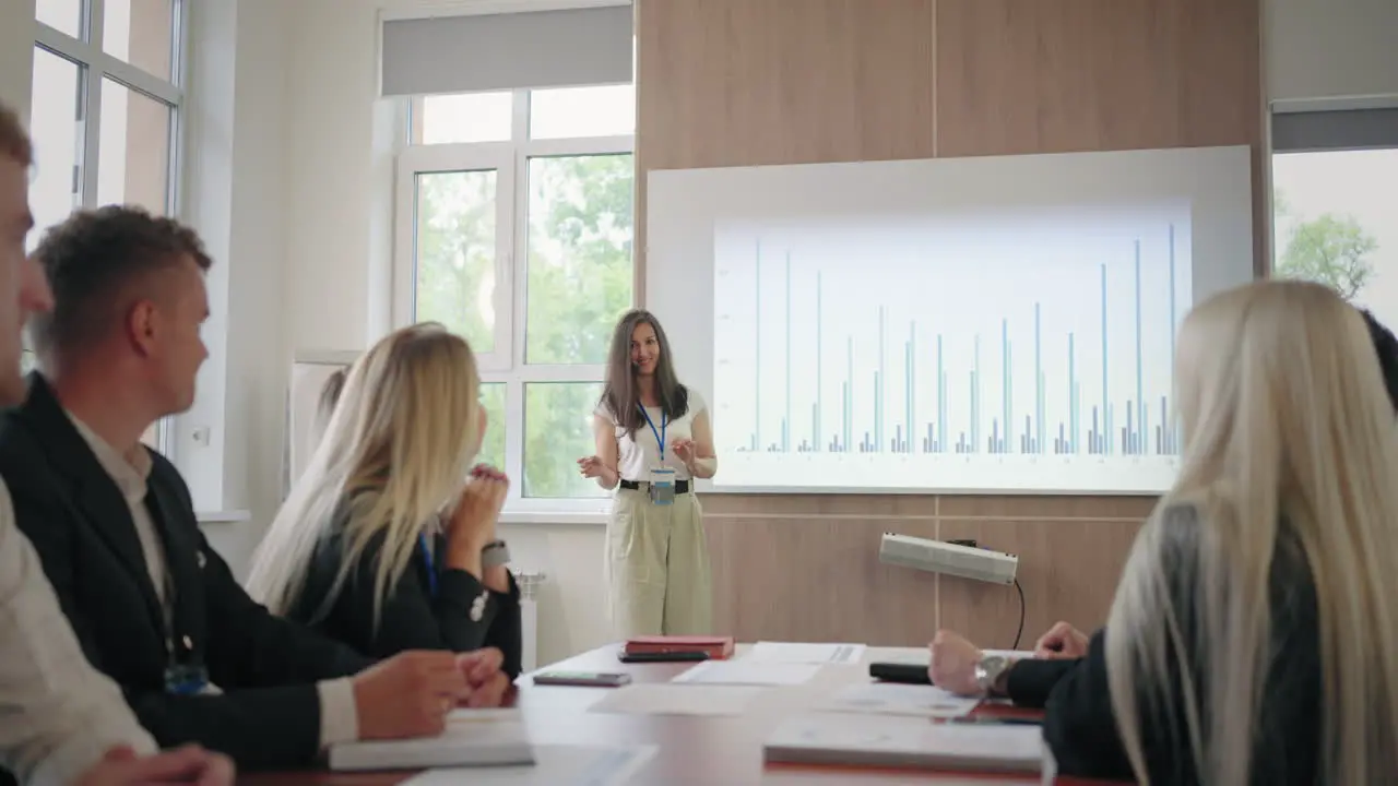 female financial analyst is speaking in business meeting with colleagues or conference for specialists