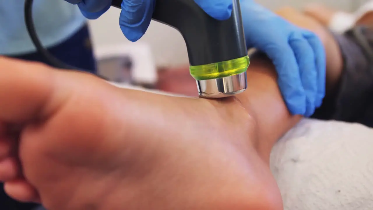 Close-up of physiotherapist giving leg massage to a patient 4k