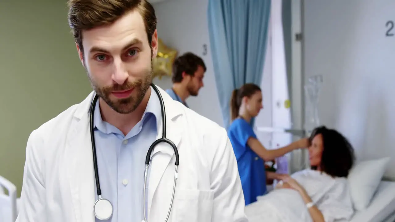 Portrait of smiling male doctor using digital tablet