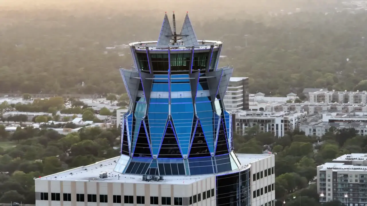 Aerial view around the crown tower on the Memorial Hermann Medical Center sunset in Houston USA orbit drone shot