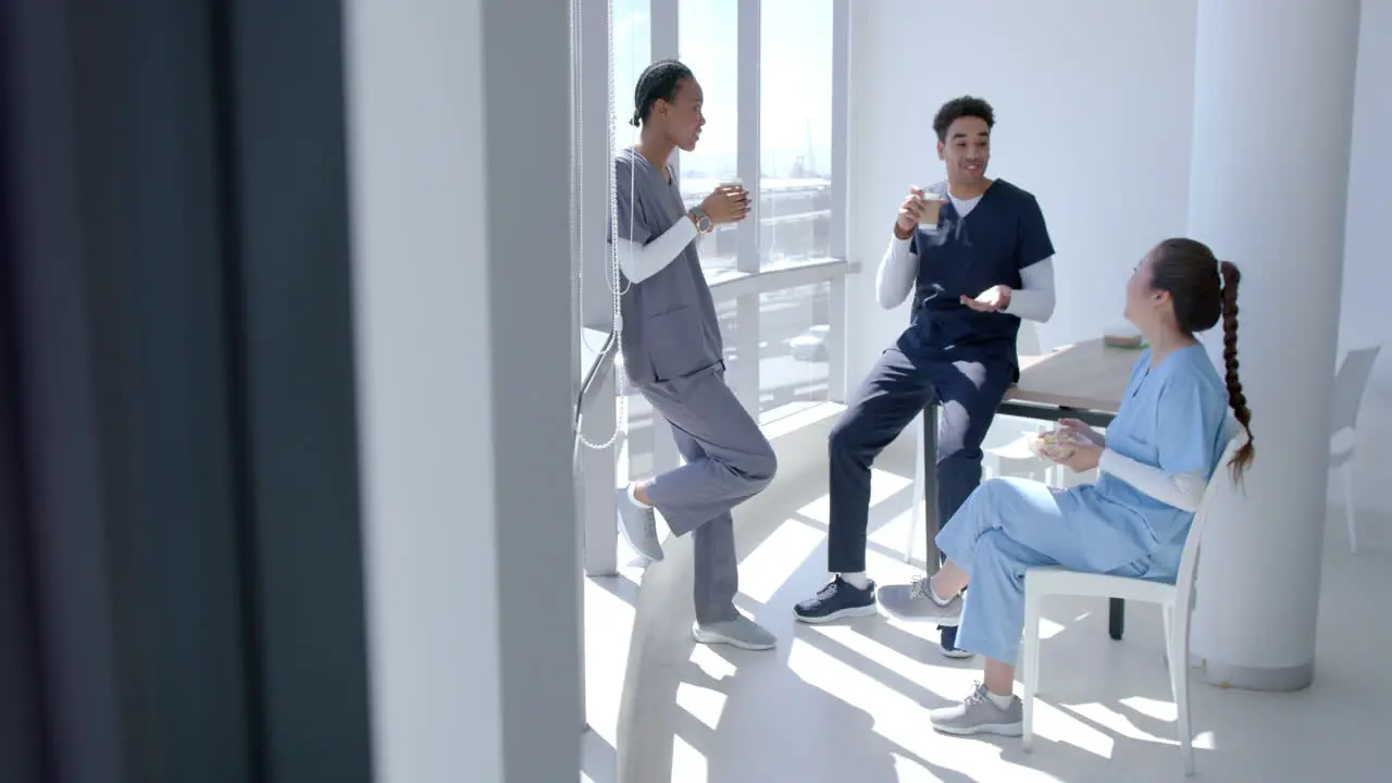 Medical professionals relax in a bright hospital break room