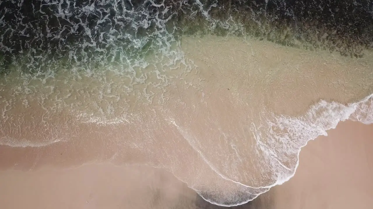 aerial view waves on the beach