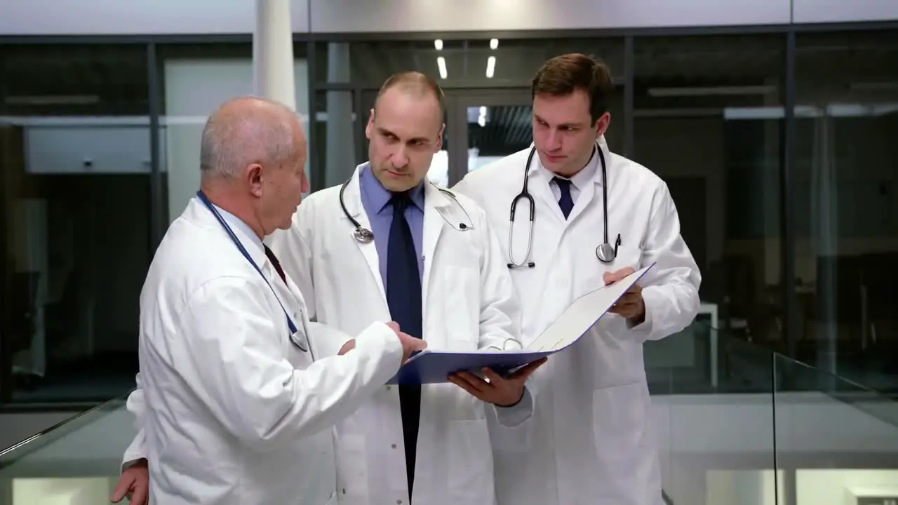 Team of doctors discussing over medical report