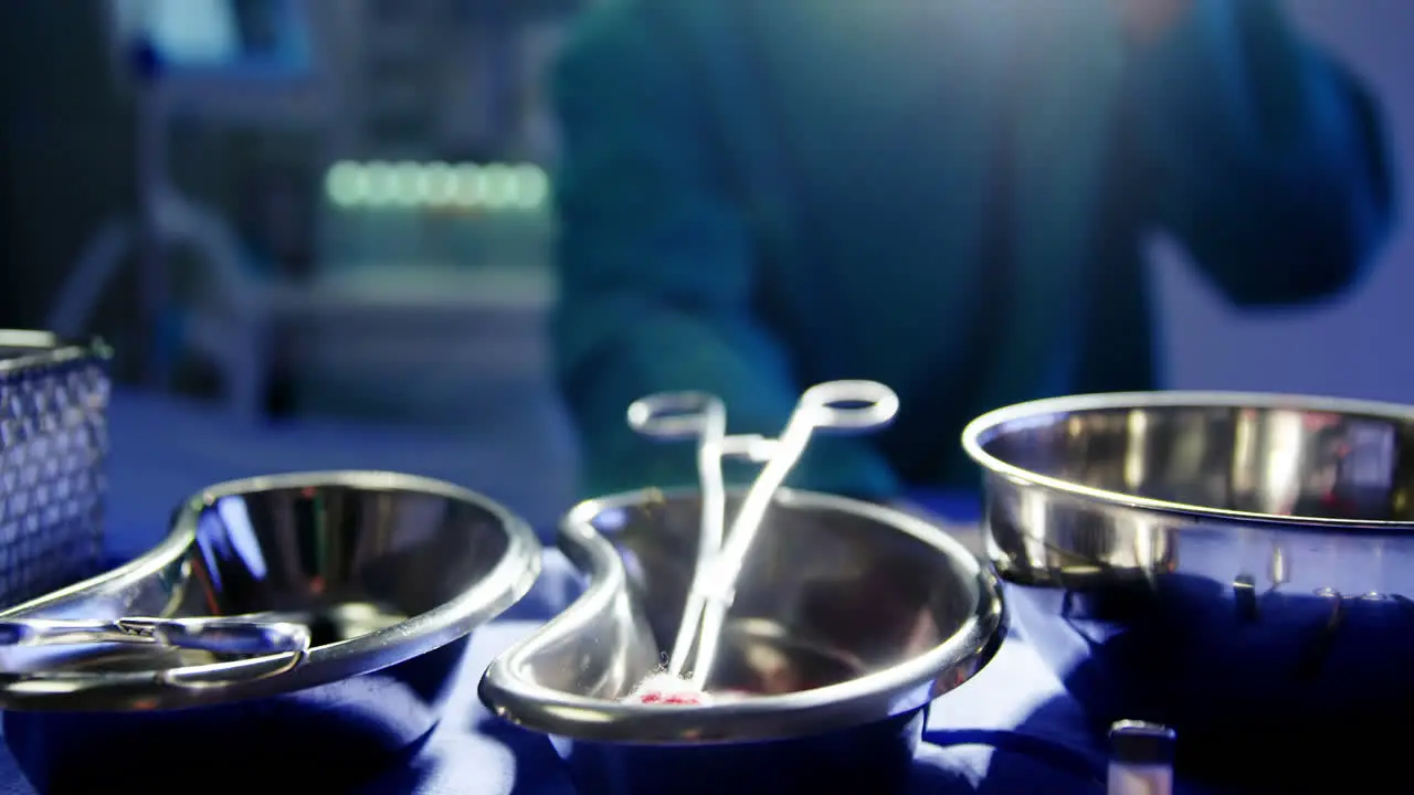 Tensed male surgeon sitting in operating room