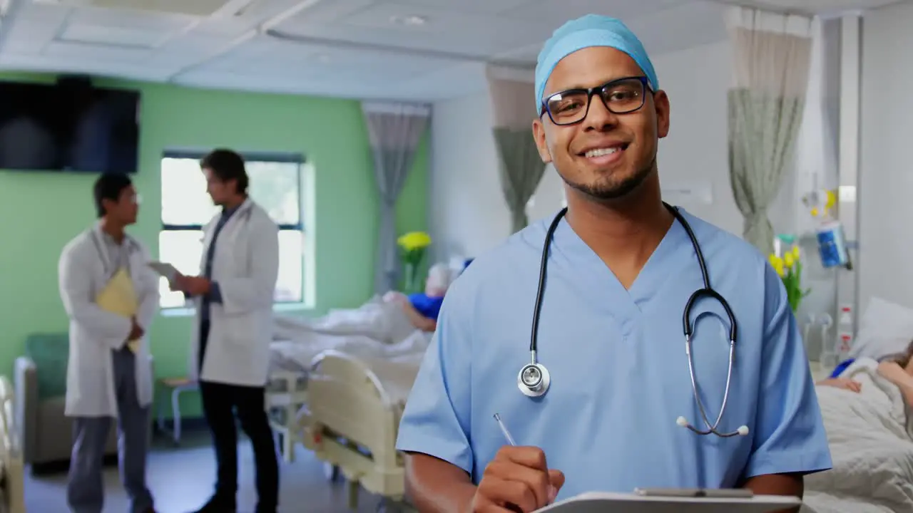 Male doctor standing in the ward at hospital 4k