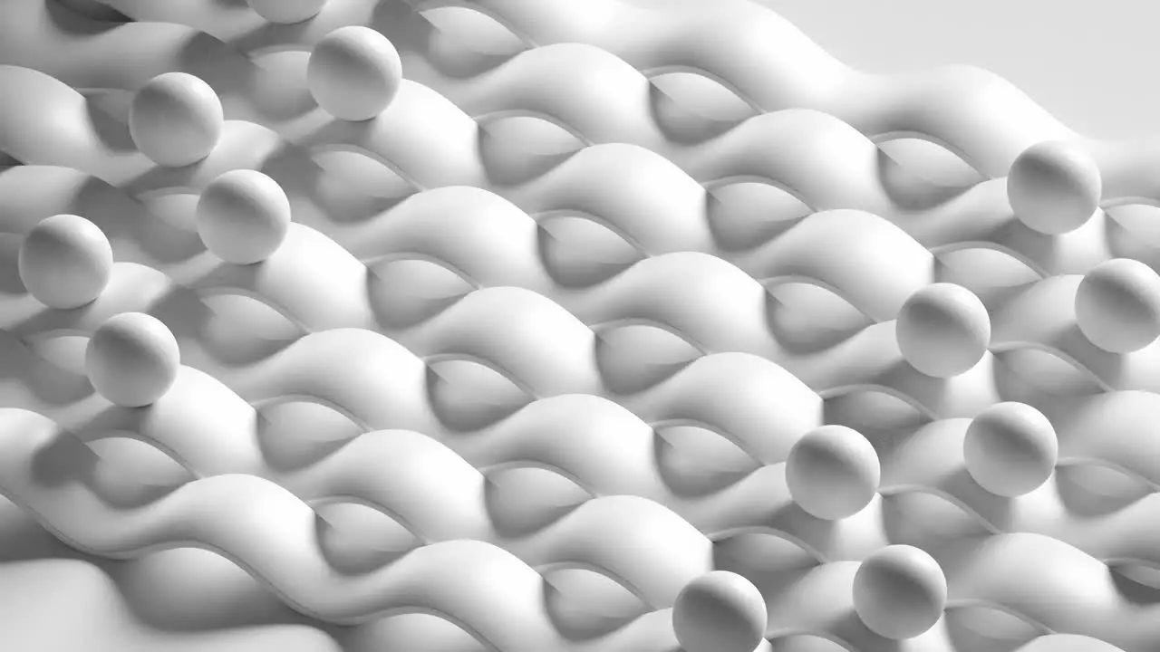 A loopable 3d render animation of white balls sliding on white cushion 3-D surface