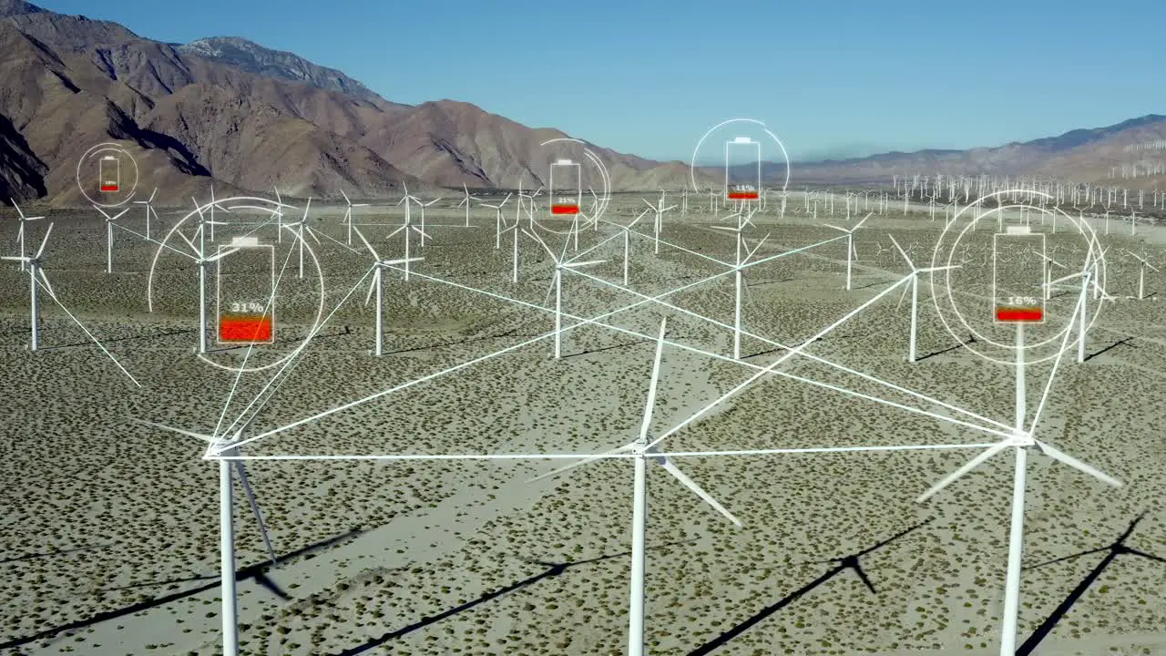 Grid lines connecting windmill turbines while batteries are charging over in California desert