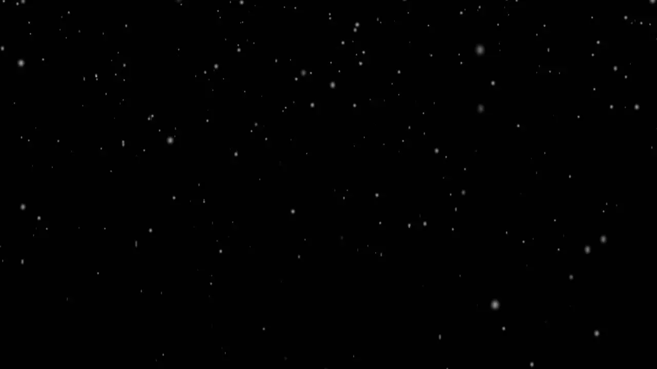 Winter snow falling snow isolated on black background in 4K to be used for composing motion graphics Large and small snow snowflakes Isolated falling snow