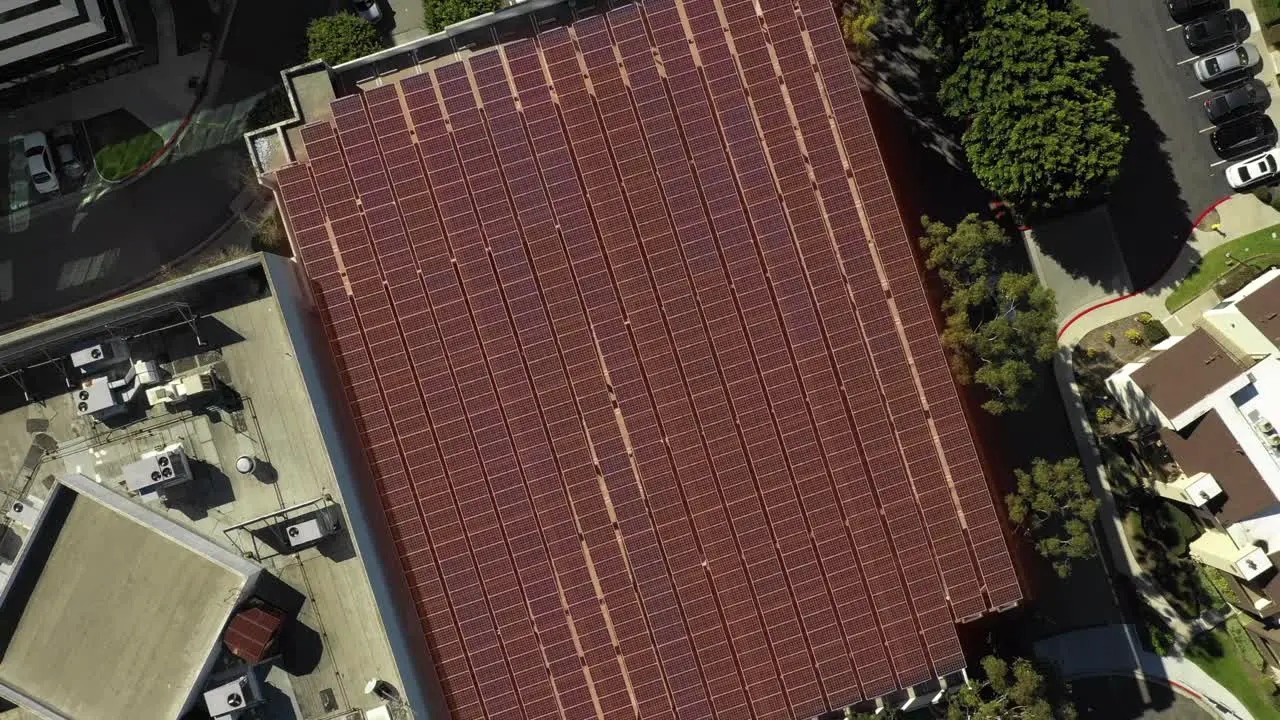 Solar panel on top of parking structure renewable energy with motion graphic aerial birds-eye