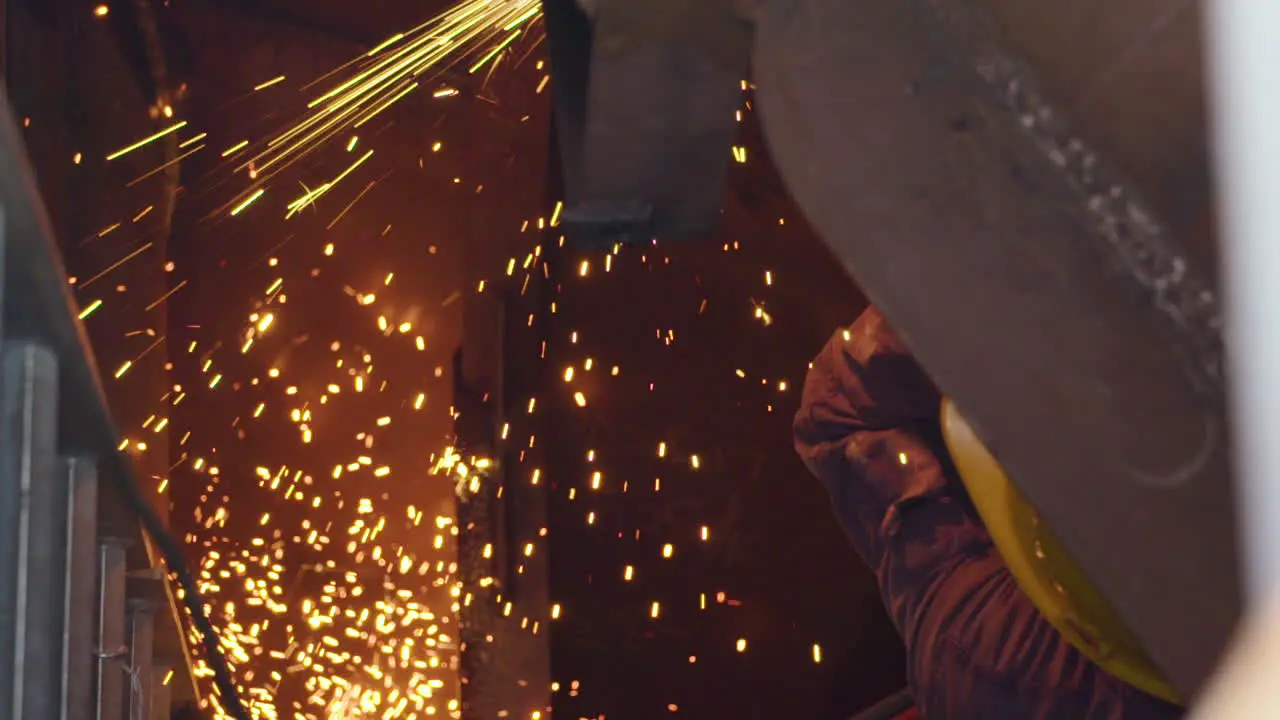 Metal cutting with oxygen acetylene torch sparks fly