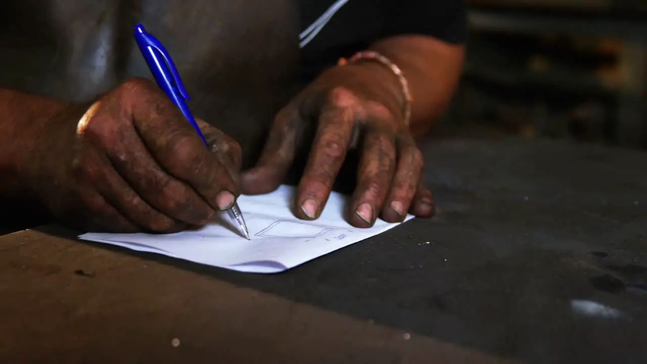 Welder working on blueprint