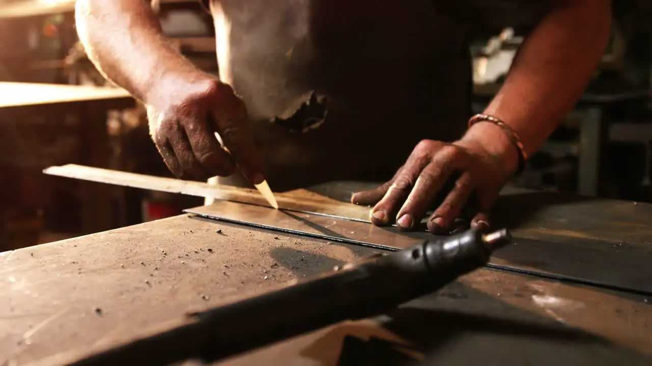 Mid-section of welder working